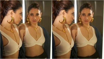 Assisted by fashion stylist, Shaleena Nathani, Tamannaah opted for golden jewellery, including statement earrings, a striking gold drop necklace, and black pump heels, adding a touch of glamour. (Instagram/@tamannaahspeaks) Assisted by fashion stylist, Shaleena Nathani, Tamannaah opted for golden jewellery, including statement earrings, a striking gold drop necklace, and black pump heels, adding a touch of glamour. (Instagram/@tamannaahspeaks)