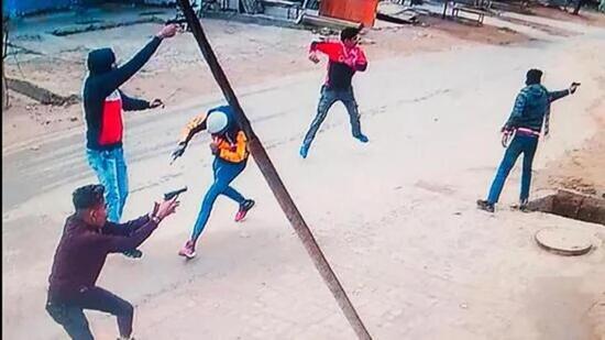 A CCTV grab of five of the six assailants firing at Pardeep Singh, a Dera Sacha Sauda follower and an accused in the 2015 Bargari sacrilege case, at his shop on Hari Nau Road in Kotkapura town of Faridkot district in Punjab on November 10, 2022. (HT Photo)