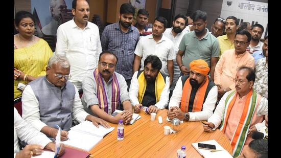 Bihar BJP president Samrat Choudhary along with leader of opposition Vijay Sinha meets teachers protesting against the new recruitment rules in Patna on Monday. (Santosh Kumar/HT Photo)