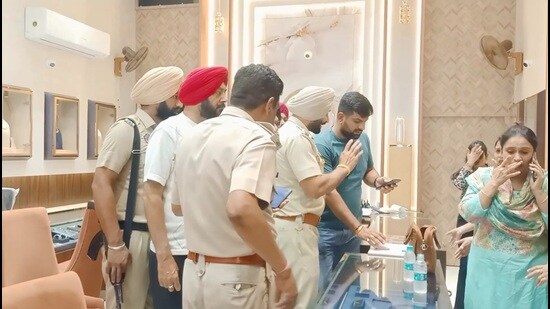 The police outside the shop in Moga on Monday. (HT photo)