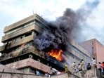 Firemen douse fire that broke out on the third floor of Satpura Bhawan, a building housing offices of various departments of the Madhya Pradesh government, in Bhopal, Monday, June 12, 2023.
