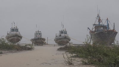 Gujarat Police boats are seen anchored on the shore as heavy rain lashes the Jakhau port ahead of the landfall of Cyclone Biparjoy, in the Kutch district, on June 12. According to the Indian Meteorological Department (IMD), the cyclone has "extensive damaging potential" and is likely to impact Gujarat's Kutch, Devbhumi Dwarka, and Jamnagar districts the most, reported PTI. (PTI) Gujarat Police boats are seen anchored on the shore as heavy rain lashes the Jakhau port ahead of the landfall of Cyclone Biparjoy, in the Kutch district, on June 12. According to the Indian Meteorological Department (IMD), the cyclone has "extensive damaging potential" and is likely to impact Gujarat's Kutch, Devbhumi Dwarka, and Jamnagar districts the most, reported PTI. (PTI)