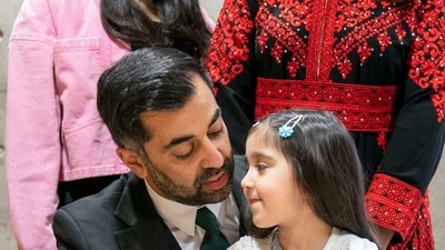 Newly elected leader of the Scottish National Party, Humza Yousaf with his his daughter Amal after signing the nomination form to become First Minister for Scotland, at the Scottish Parliament in Edinburgh, on March 28. (AFP) Newly elected leader of the Scottish National Party, Humza Yousaf with his his daughter Amal after signing the nomination form to become First Minister for Scotland, at the Scottish Parliament in Edinburgh, on March 28. (AFP)