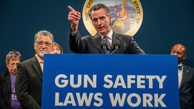 FILE - California Gov. Gavin Newsom answers questions at a press conference in Sacramento, Calif., on Feb. 1, 2023. Newsom announced Thursday, June 8, 2023, that he is proposing an amendment to the United States Constitution that would enshrine into law gun regulations including universal background checks and raising the minimum age to buy a firearm to 21, his latest foray into national politics. (Renée C. Byer/The Sacramento Bee via AP, File) (AP) FILE - California Gov. Gavin Newsom answers questions at a press conference in Sacramento, Calif., on Feb. 1, 2023. Newsom announced Thursday, June 8, 2023, that he is proposing an amendment to the United States Constitution that would enshrine into law gun regulations including universal background checks and raising the minimum age to buy a firearm to 21, his latest foray into national politics. (Renée C. Byer/The Sacramento Bee via AP, File) (AP)