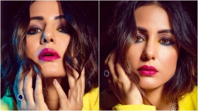 Hina accessorised the outfit with retro sunnies, a layered necklace, matching earrings, and rings. In the end, Hina chose darkened brows, bold red lip shade, smoky eyes, blue and yellow kajal, beaming highlighter, and rouged cheeks for the glam picks. (Instagram) Hina accessorised the outfit with retro sunnies, a layered necklace, matching earrings, and rings. In the end, Hina chose darkened brows, bold red lip shade, smoky eyes, blue and yellow kajal, beaming highlighter, and rouged cheeks for the glam picks. (Instagram)