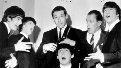 American speed skating champion Terry McDermott, background center, a barber by trade, prepares to take a swipe at the famed locks of Beatle Paul McCartney, seated , to the mock horror of the other Beatles and TV host Ed Sullivan, during rehearsals at the TV Studio, New York, Feb. 9, 1964. From left, George Harrison, Ringo Starr, McDermott, Ed Sullivan and John Lennon. McDermott, who won the only gold medal for the United States at the 1964 Winter Olympics, died on Saturday, May 20, 2023, U.S. Speedskating said. He was 82. (AP) American speed skating champion Terry McDermott, background center, a barber by trade, prepares to take a swipe at the famed locks of Beatle Paul McCartney, seated , to the mock horror of the other Beatles and TV host Ed Sullivan, during rehearsals at the TV Studio, New York, Feb. 9, 1964. From left, George Harrison, Ringo Starr, McDermott, Ed Sullivan and John Lennon. McDermott, who won the only gold medal for the United States at the 1964 Winter Olympics, died on Saturday, May 20, 2023, U.S. Speedskating said. He was 82. (AP)