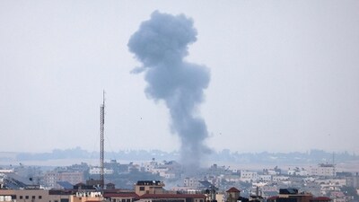 Smoke rises above buildings in Gaza city following an Israeli air strike on May 12, 2023. Israel and Gaza militants traded heavy fire on May 12, as hopes faded of securing a truce to end days of fighting that have killed dozens, all but one of them Palestinian. (Photo by Mahmud HAMS / AFP) (AFP)
