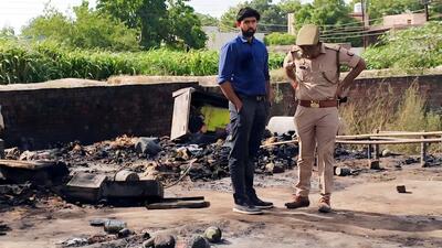 Police officers at the spot where the girl died in the fire in Ghaziabad on Tuesday. (Sakib Ali/HT Photo) Police officers at the spot where the girl died in the fire in Ghaziabad on Tuesday. (Sakib Ali/HT Photo)