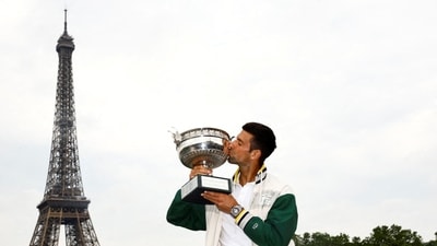 Novak Djokovic kisses the French Open trophy in front of the Eiffel Tower (REUTERS)