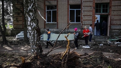 Ukrainian officials had said earlier on Tuesday that three people had been killed and many more were trapped under the rubble of a five-storey apartment building. (AFP)