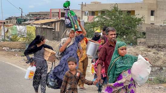 Villagers are seen leaving Jakhau village during an evacuation ahead of cyclone Biparjoy’s landfall, in the Kutch district, Gujarat on June 12.&nbsp;(PTI)