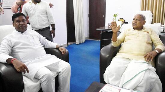 Santosh Kumar Suman with father Jitan Ram Manjhi at their Patna residence after quitting the state cabinet on Tuesday. (Santosh Kumar/HT Photo)