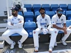 India's KS Bharat (C) and Mohammed Shami (R) share a light moment as India's captain Rohit Sharma (L) 