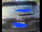 Newlywed puts Venmo sign on car.