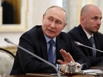Russian president Vladimir Putin attends a meeting.