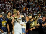 Nikola Jokic (in middle) with Denver Nuggets after the side's NBA title triumph Nikola Jokic (in middle) with Denver Nuggets after the side's NBA title triumph