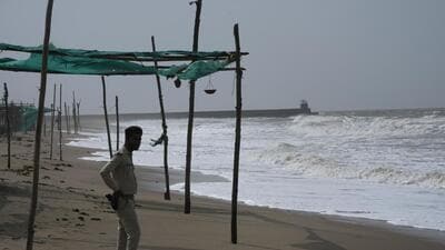 A policeman stands guard on a deserted beach on the Arabia Sea coast at Mandvi in Kutch district of Gujarat (AP) A policeman stands guard on a deserted beach on the Arabia Sea coast at Mandvi in Kutch district of Gujarat (AP)