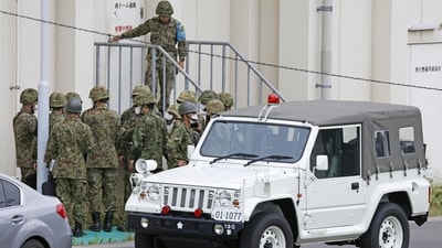 Members of the Japanese Self-Defence Force (SDF) are seen around the shooting range in Japan. (via Reuters)