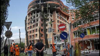 Municipal workers work at a place near a shopping mall damaged by a Russian missile strike, in Odesa, Ukraine, on Wednesday. (REUTERS) Municipal workers work at a place near a shopping mall damaged by a Russian missile strike, in Odesa, Ukraine, on Wednesday. (REUTERS)