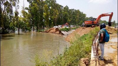Repairs underway on the CLC near village Barwasni in Sonepat on Wednesday. (PTI) Repairs underway on the CLC near village Barwasni in Sonepat on Wednesday. (PTI)