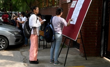Aspirants queue for UPSC preliminary exam in Delhi. Aspirants queue for UPSC preliminary exam in Delhi.