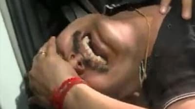 Tamil Nadu minister Senthil Balaji grimaces in pain outside a government hospital in Chennai. (ANI)