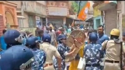 Security personnel trying to control the situation in Bankura where clashes erupted between TMC and BJP workers. (Twitter/PTI)