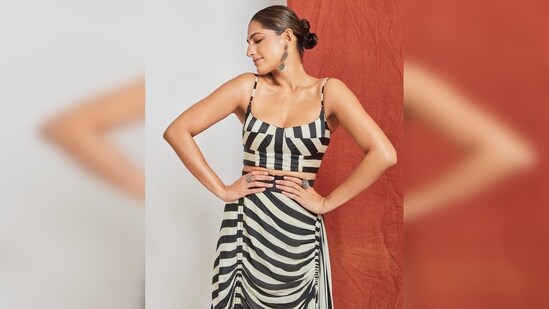 Kubbra Sait elevated her chic look with silver oxidised jewellery and silver open-toe stilettoes.&nbsp;(Instagram/@kubbrasait)