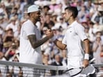 Serbia's Novak Djokovic (R) celebrates beating Australia's Nick Kyrgios in the Wimbledon 2022 final 