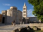 People walk in the old town of Zadar, Croatia. Croatia eying record tourist season after joining Europe's Schengen area 