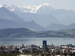 FILE PHOTO: The snow-covered peaks of Bernese Oberland are seen behind Lake Zug and the city of Zug, Switzerland August 20, 2020. REUTERS/Arnd Wiegmann/File Photo(REUTERS)