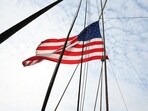NEW YORK, NEW YORK - JUNE 14: An American flag is seen waving in the wind aboard the Wavertree during a naturalization ceremony on June 14, 2023 in New York City. U.S. Citizenship and Immigration Services and the South Street Seaport Museum celebrated Flag Day by welcoming 20 new U.S. citizens by hosting a naturalization ceremony aboard the 1885 Tall Ship Wavertree. The 20 candidates were from 17 countries and 5 of the candidates are current or former members of the U.S. Military. 