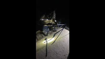 A lineman joining a burnt cable late in the night to ensure power supply in a lane in old city area. (HT Photo) A lineman joining a burnt cable late in the night to ensure power supply in a lane in old city area. (HT Photo)