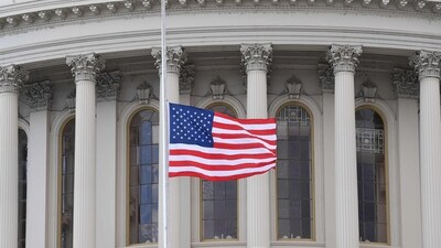 A US flag is raised after the inauguration of Joe Biden as the 46th US President on January 20, 2021, at the US Capitol in Washington, DC. (Photo by ANGELA WEISS / AFP) (AFP) A US flag is raised after the inauguration of Joe Biden as the 46th US President on January 20, 2021, at the US Capitol in Washington, DC. (Photo by ANGELA WEISS / AFP) (AFP)