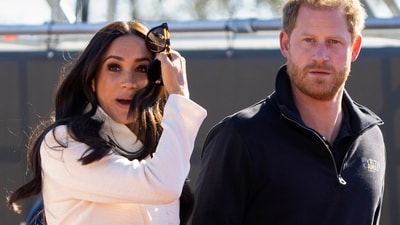 FILE - Prince Harry and Meghan Markle, Duke and Duchess of Sussex visit the track and field event at the Invictus Games in The Hague, Netherlands, Sunday, April 17, 2022.  A spokesperson for Prince Harry and his wife Meghan says the couple were involved in a car chase while being followed by photographers. The couple’s office says the pair and Meghan’s mother were followed for more than two hours by a half-dozen vehicles after leaving a charity event in New York on Tuesday, May 16, 2023. (AP Photo/Peter Dejong, File) (AP)