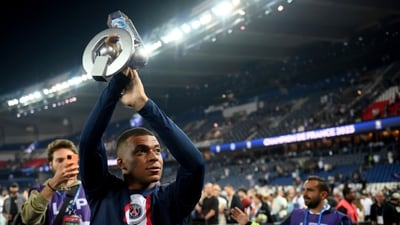PSG forward Kylian Mbappe holds up his trophy during the ceremony following the team's French League One soccer match loss to Clermont, in Paris (AP) PSG forward Kylian Mbappe holds up his trophy during the ceremony following the team's French League One soccer match loss to Clermont, in Paris (AP)