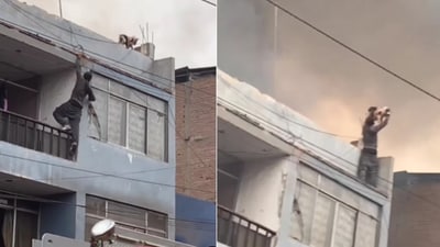 The image shows the man scaling a burning building to save a dog. (Instagram/@goodnews_movement) The image shows the man scaling a burning building to save a dog. (Instagram/@goodnews_movement)