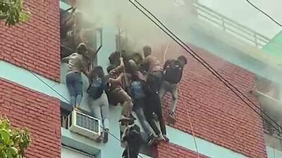 Many students were injured when they fell while attempting to descend the four-storey building using ropes and pipes. (ANI) Many students were injured when they fell while attempting to descend the four-storey building using ropes and pipes. (ANI)
