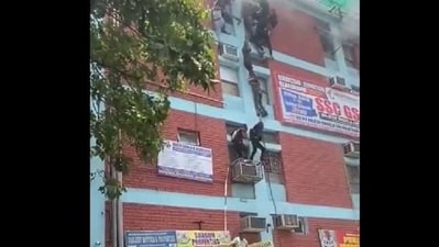 Students were seen climbing down from the window with the help of wires as a fire was reported at a coaching centre in Delhi's Mukherjee Nagar.