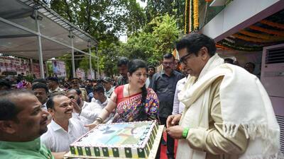 Mumbai, June 14 (ANI): Maharashtra Navnirman Sena Chief Raj Thackeray along with his wife Sharmila Thackeray receive a cake as party workers and followers celebrate his 55th birthday, in Mumbai on Wednesday. (ANI Photo) (Nitin Lawate)