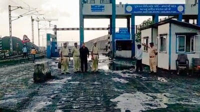 Police personnel and other officials at Navlakhi Port ahead of the landfall of Cyclone Biparjoy, near Morbi. (PTI)