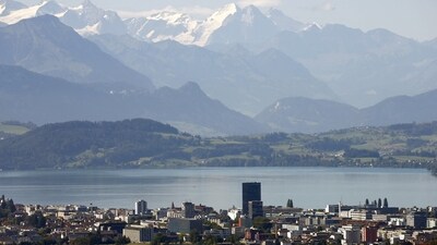 FILE PHOTO: The snow-covered peaks of Bernese Oberland are seen behind Lake Zug and the city of Zug, Switzerland August 20, 2020.  REUTERS/Arnd Wiegmann/File Photo (REUTERS)