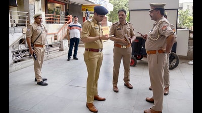 The police outside a mall in Indirapuram during the raid at a spa centre in Ghaziabad on Thursday. (Sakib Ali/HT Photo) The police outside a mall in Indirapuram during the raid at a spa centre in Ghaziabad on Thursday. (Sakib Ali/HT Photo)