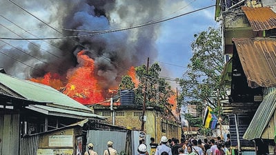 Two houses were set ablaze in Imphal on Thursday. (PTI) Two houses were set ablaze in Imphal on Thursday. (PTI)