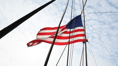NEW YORK, NEW YORK - JUNE 14: An American flag is seen waving in the wind aboard the Wavertree during a naturalization ceremony on June 14, 2023 in New York City. U.S. Citizenship and Immigration Services and the South Street Seaport Museum celebrated Flag Day by welcoming 20 new U.S. citizens by hosting a naturalization ceremony aboard the 1885 Tall Ship Wavertree. The 20 candidates were from 17 countries and 5 of the candidates are current or former members of the U.S. Military. (Getty Images via AFP)
