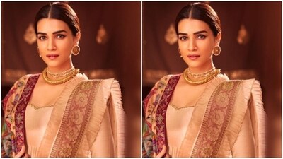 In a gold neck choker, multiple chains, statement ear studs and rings, Kriti further accessorised her look for the day. (Instagram/@kritisanon) In a gold neck choker, multiple chains, statement ear studs and rings, Kriti further accessorised her look for the day. (Instagram/@kritisanon)