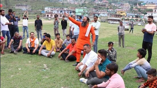 A few right wing activists staging a symbolic protest at Purola stadium after failing to hold mahapanchayat. (HT Photo | Rajeev Kala)