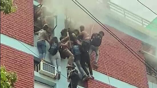 Many students were injured when they fell while attempting to descend the four-storey building using ropes and pipes. (ANI)
