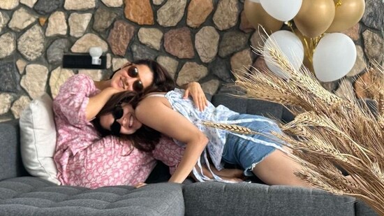 She shared another photo with Angira Dhar. The two posed for the camera as they sat on a couch with black, white and golden birthday balloons in the background.&nbsp;