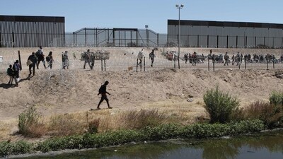 The department said the gang charged migrants between $10,000 and $70,000 for package deals of travel to Mexico, fake documents and smuggling fees to enter the United States. (File) (Herika Martinez / AFP )